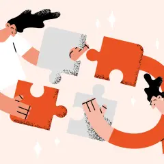 Two people assemble puzzle pieces, symbolizing the collaborative effort needed for a successful annual fund plan.