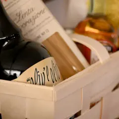 A gift basket with olive oil and pasta, perfect for a Chinese auction prize.