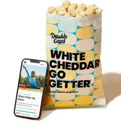 A bag of Double Good White Cheddar popcorn and a smartphone displaying a virtual fundraiser for Skye's Pop-Up Store, showcasing how virtual fundraisers like Double Good support teams.