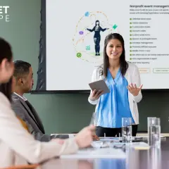 A presenter explains nonprofit event management tools, highlighting features for free event tickets for nonprofit organizations.