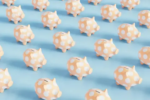 Rows of peach piggy banks with white polka dots on a light blue background. A fun visual for a 50/50 cash raffle.
