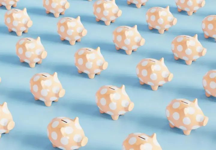 Rows of peach piggy banks with white polka dots on a light blue background. A fun visual for a 50/50 cash raffle.