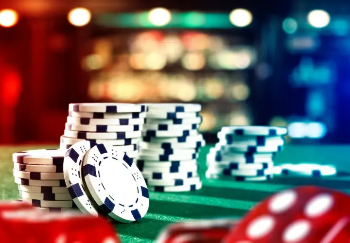 Stacks of casino chips on a green felt table, ready for a casino fundraiser.