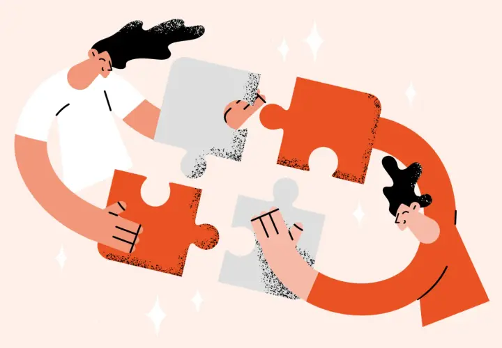 Two people assemble puzzle pieces, symbolizing the collaborative effort needed for a successful annual fund plan.