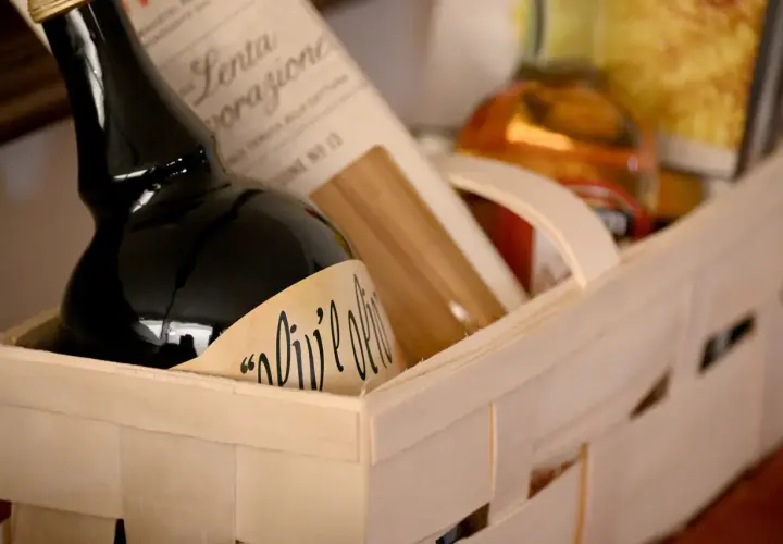 A gift basket with olive oil and pasta, perfect for a Chinese auction prize.