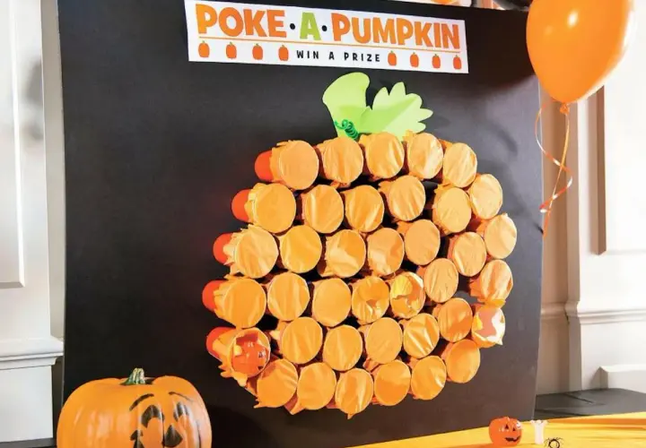 Poke-a-Pumpkin" game board, a fun fall festival idea for adults. Orange cups form a pumpkin shape, hiding prizes.