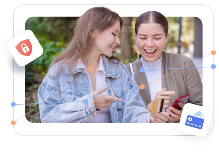 Two women excitedly look at a phone and credit card, suggesting easy transactions on giving day platforms.