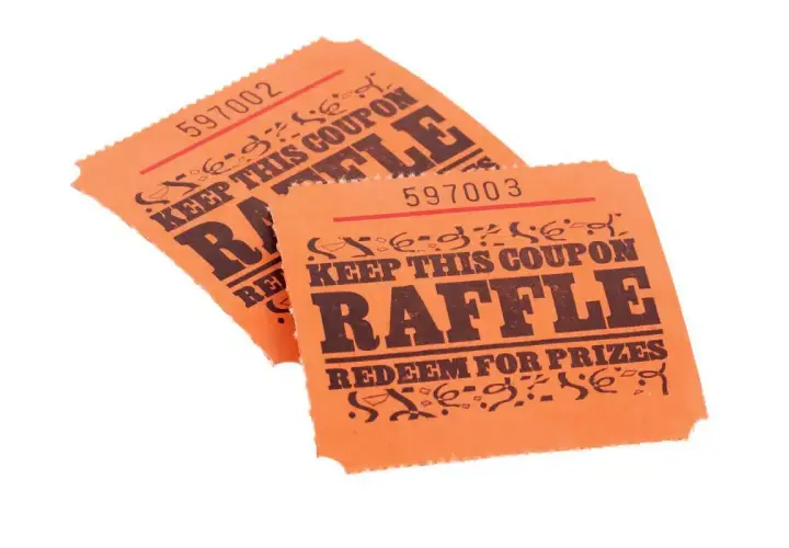 Two orange raffle tickets, numbered 597002 and 597003, with "RAFFLE" and "REDEEM FOR PRIZES" printed on them. These could be used for a fundraiser, but check Arizona raffle laws first.