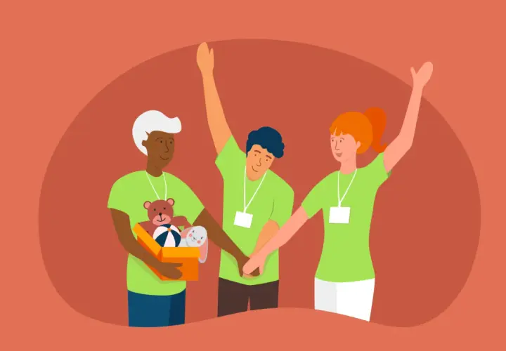 Three diverse volunteers in green shirts with lanyards, one holding a box of toys, show how to get volunteers for a nonprofit.