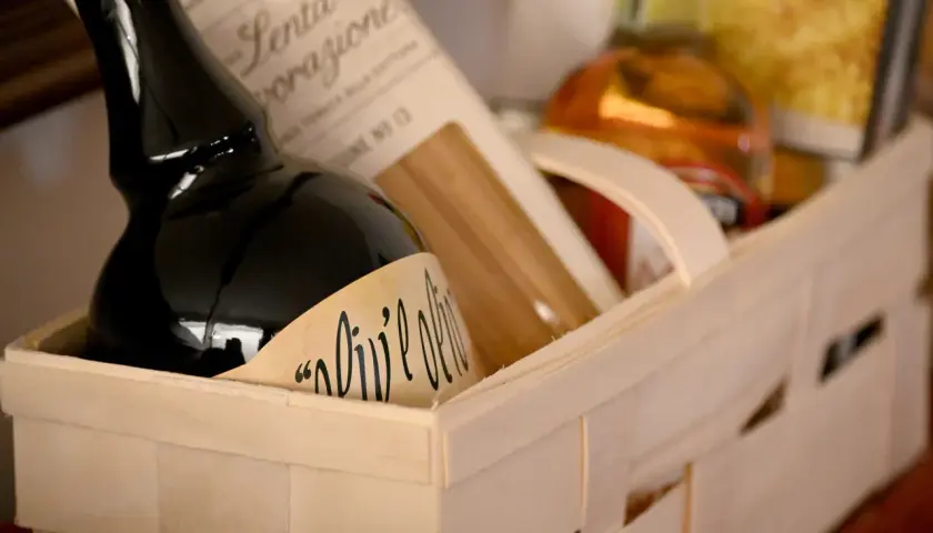 A gift basket with olive oil and pasta, perfect for a Chinese auction prize.