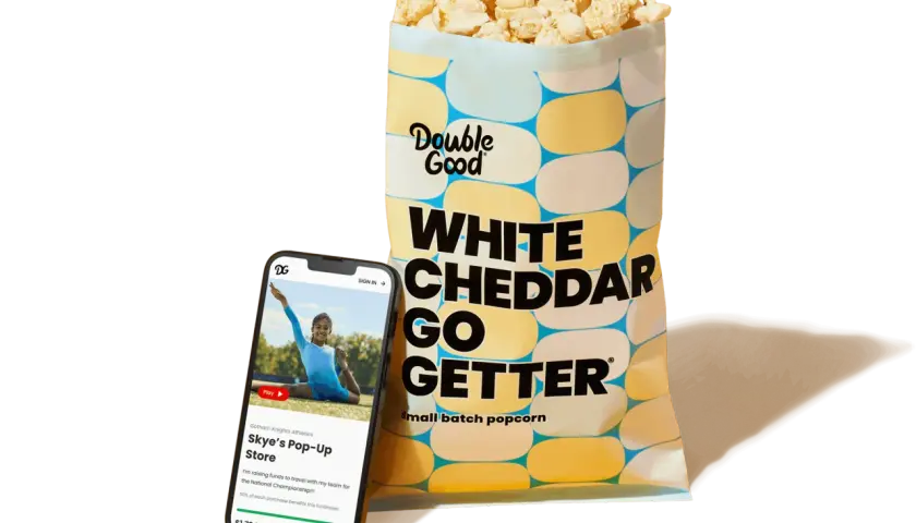 A bag of Double Good White Cheddar popcorn and a smartphone displaying a virtual fundraiser for Skye's Pop-Up Store, showcasing how virtual fundraisers like Double Good support teams.