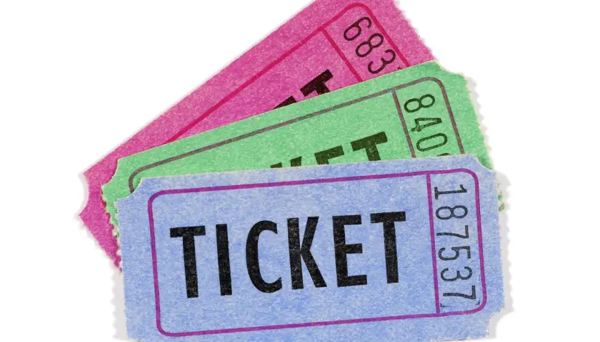Three colorful raffle tickets, blue, green, and pink, are fanned out. Are raffles legal in California?