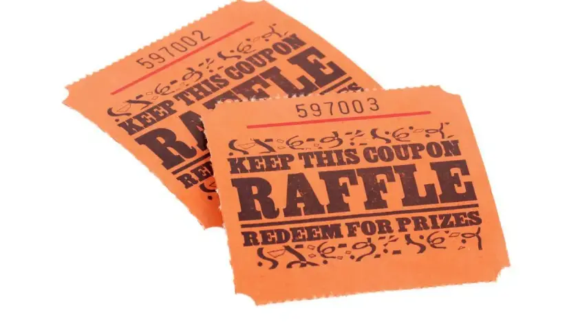 Two orange raffle tickets, numbered 597002 and 597003, with "RAFFLE" and "REDEEM FOR PRIZES" printed on them. These could be used for a fundraiser, but check Arizona raffle laws first.