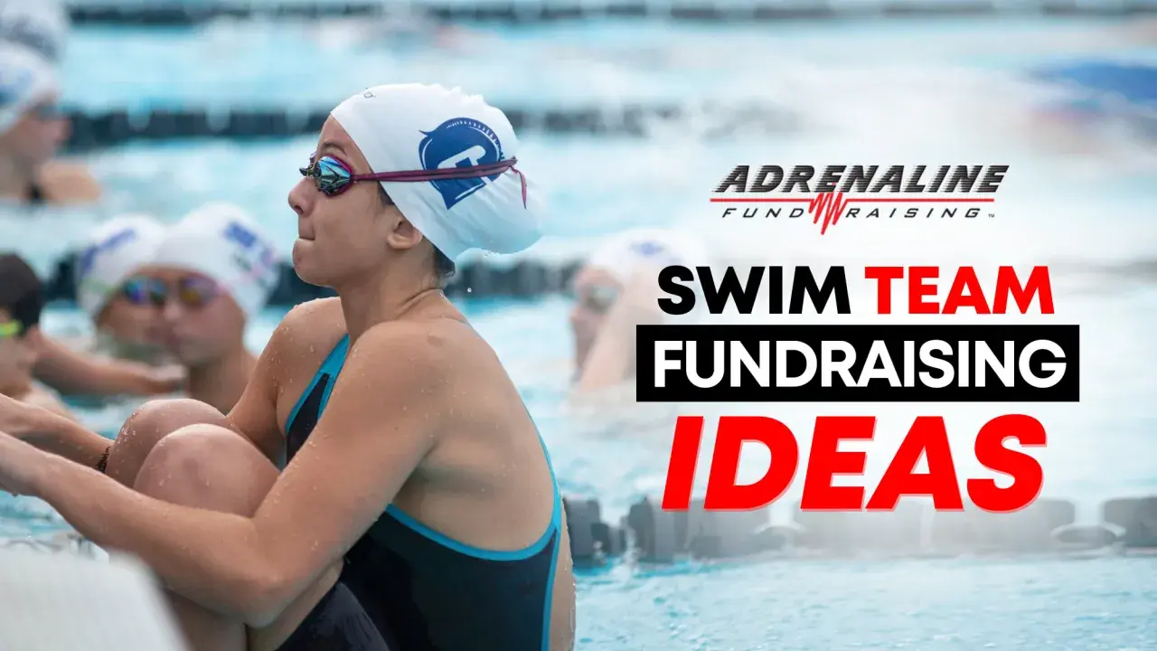 Young swimmers in a pool, ready for action. The image promotes swim team fundraising ideas.