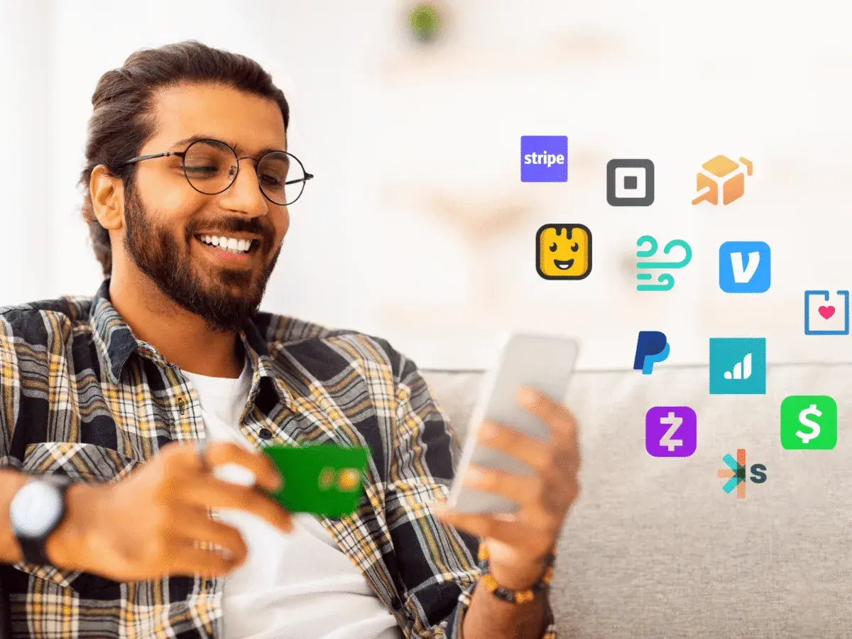 Smiling man with a credit card and phone surrounded by payment app icons, including Stripe, PayPal, and others, suggesting easy transactions and managing cheddar up fees.