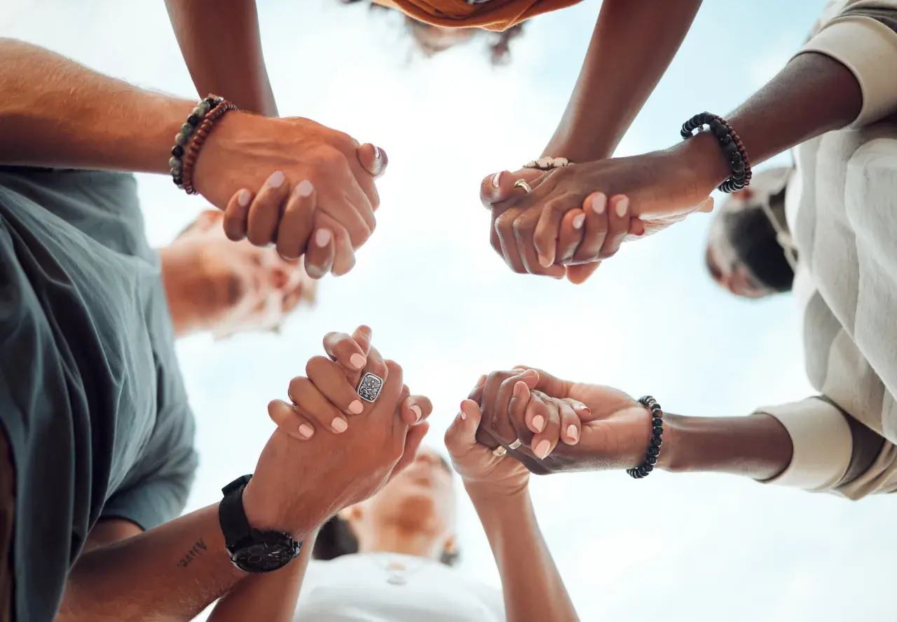 Hands clasped in unity, a circle of support. Ready to give, send, and go forward together.
