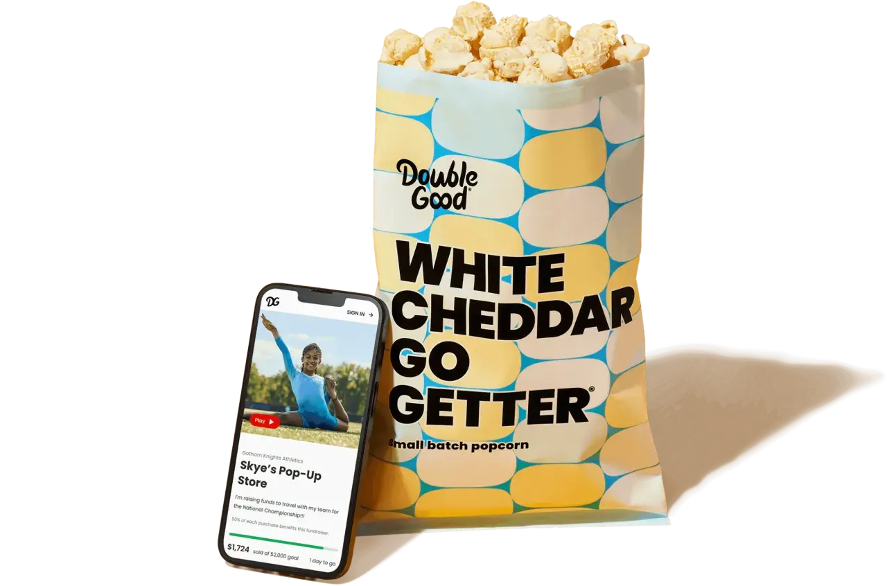 A bag of Double Good White Cheddar popcorn and a smartphone displaying a virtual fundraiser for Skye's Pop-Up Store, showcasing how virtual fundraisers like Double Good support teams.
