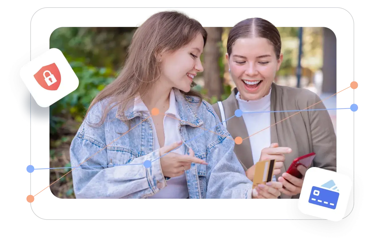 Two women excitedly look at a phone and credit card, suggesting easy transactions on giving day platforms.