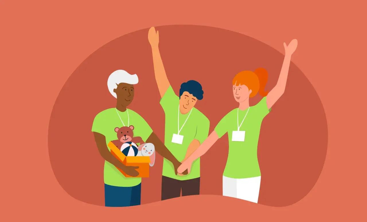 Three diverse volunteers in green shirts with lanyards, one holding a box of toys, show how to get volunteers for a nonprofit.