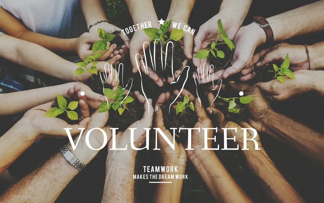 A diverse group of hands holds young plants, symbolizing growth and community. The word 