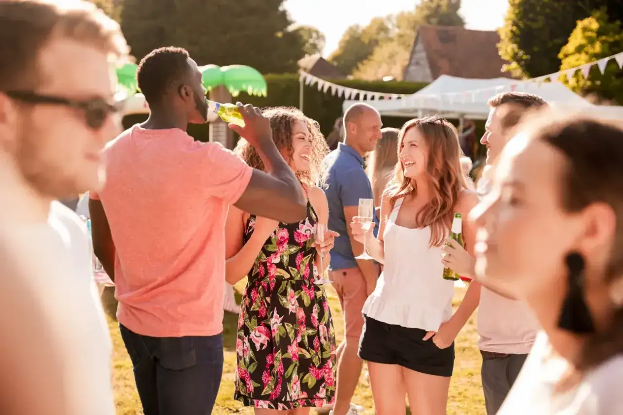 Friends enjoying a garden party, a perfect setting for brainstorming fun march fundraising ideas.